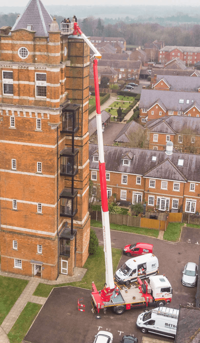Palfinger WT 450 truck-mounted platform working beside a tall building